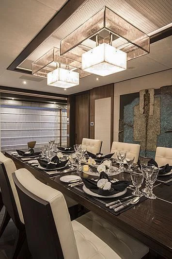 a dining room with a table set aboard JODI ANN Yacht for Charter