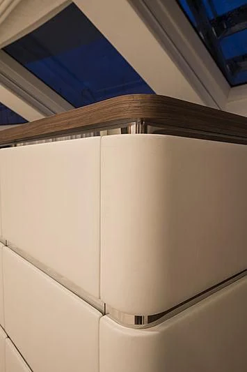 a white toilet with a blue seat aboard JODI ANN Yacht for Charter