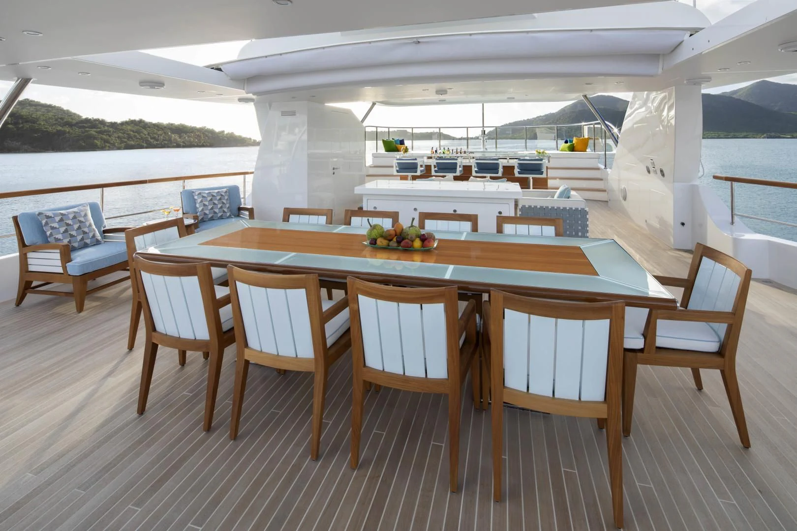 a table with chairs around it aboard JODI ANN Yacht for Charter