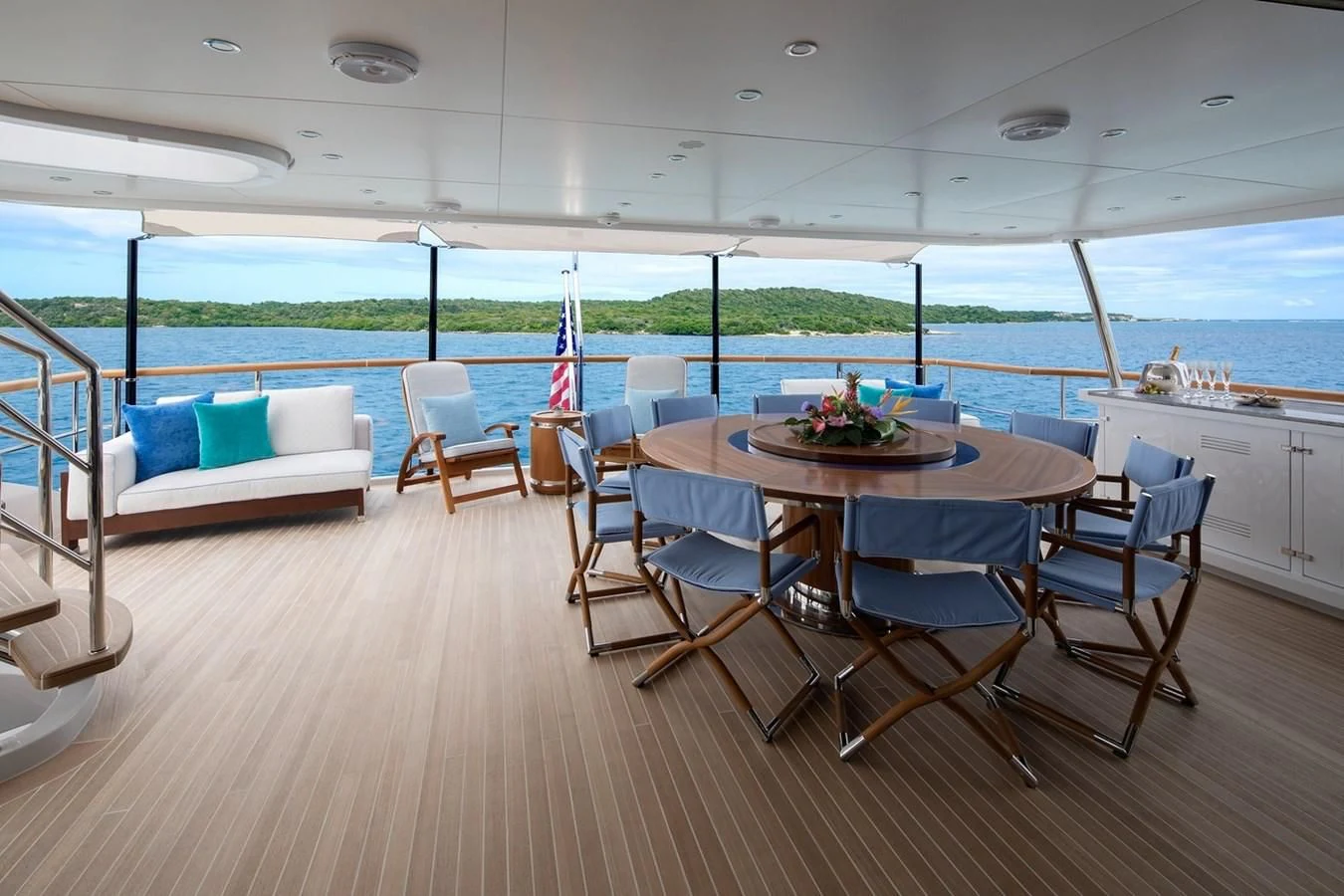 a large dining table on a deck aboard JODI ANN Yacht for Charter