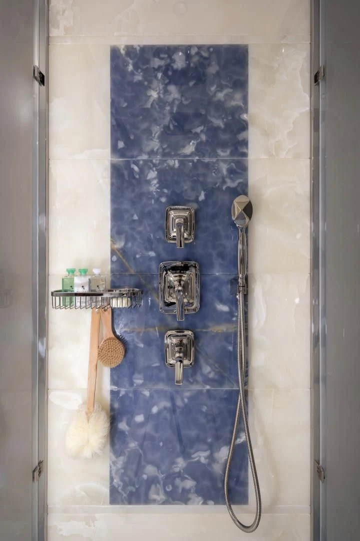 a shower with a blue wall aboard JODI ANN Yacht for Charter