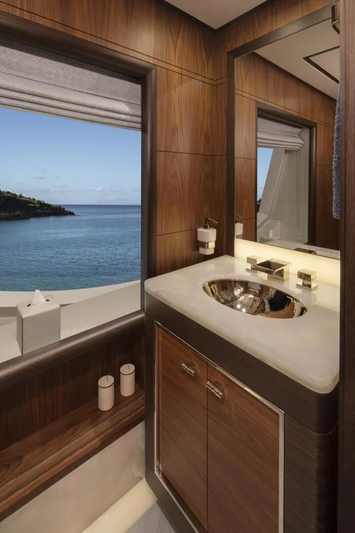 a bathroom with a sink and a window aboard JODI ANN Yacht for Charter