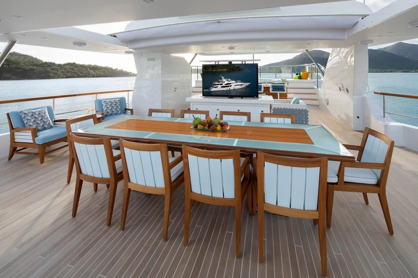a table with chairs around it aboard JODI ANN Yacht for Charter