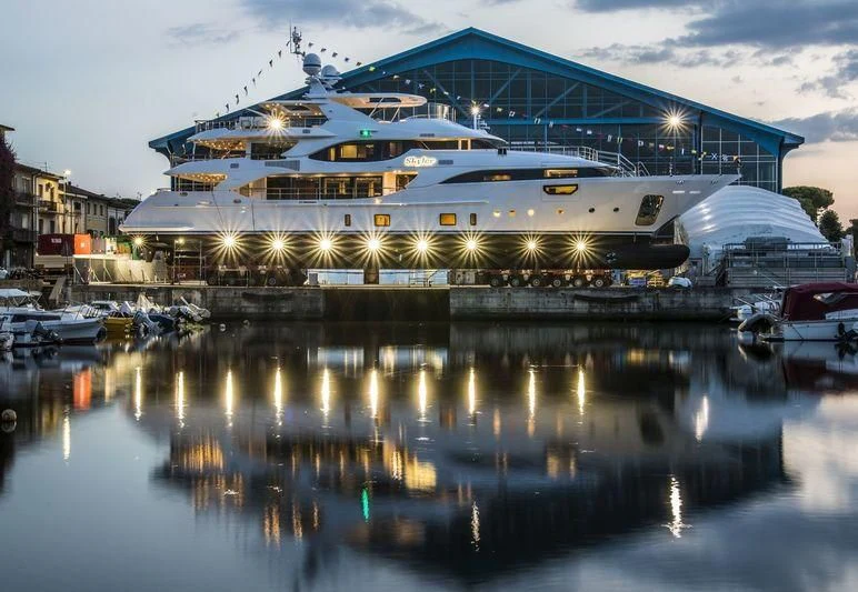 a large cruise ship docked at a pier aboard JODI ANN Yacht for Charter