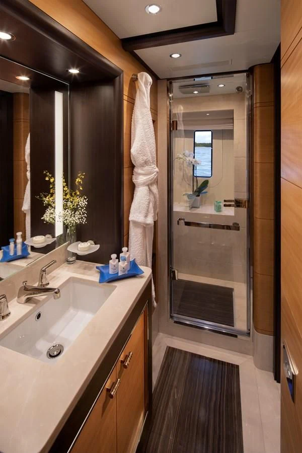 a bathroom with a glass shower aboard JODI ANN Yacht for Charter