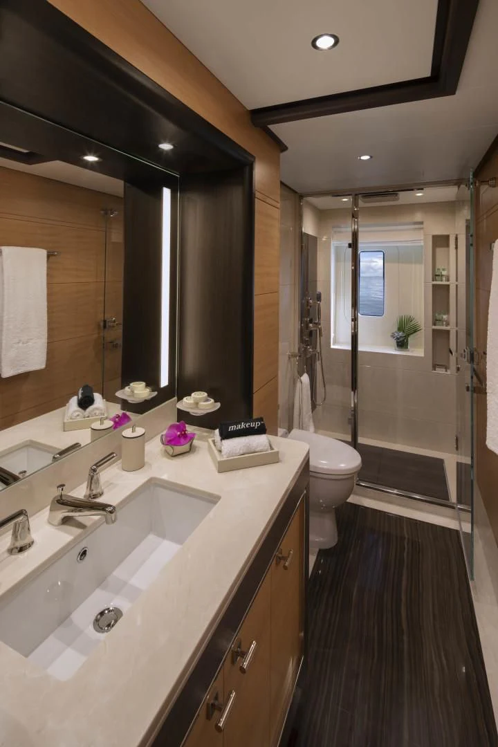 a bathroom with a sink and a shower aboard JODI ANN Yacht for Charter