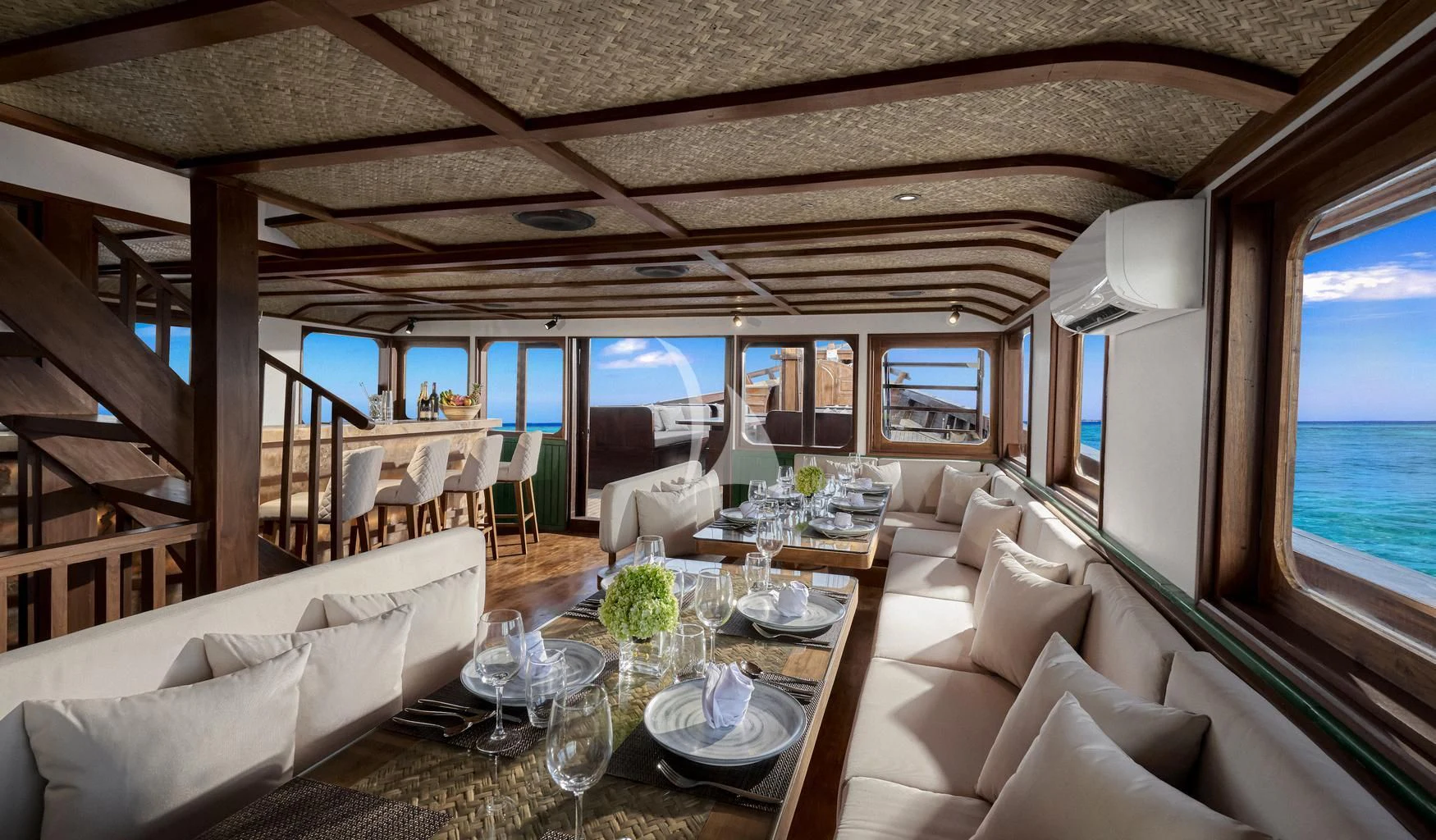 a room with a table chairs and a large window aboard SAMSARA SAMUDRA Yacht for Sale