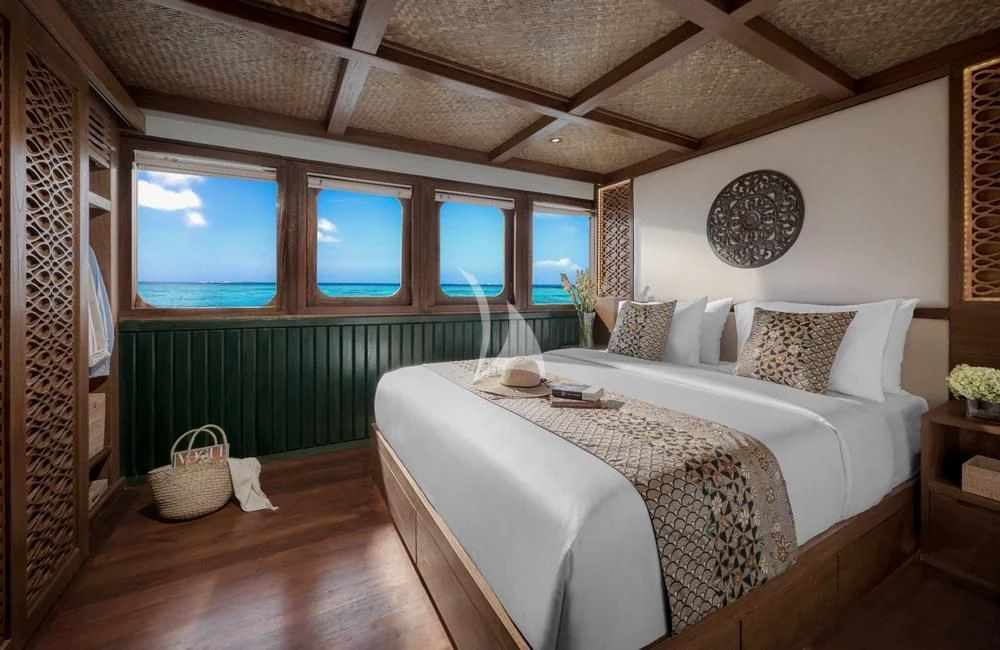 a bed in a room aboard SAMSARA SAMUDRA Yacht for Sale