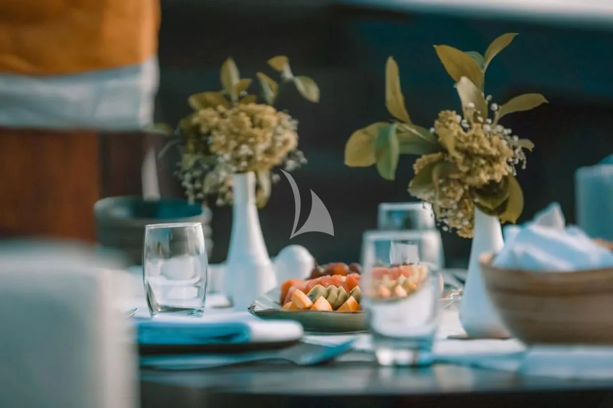 a vase of flowers on a table aboard SAMSARA SAMUDRA Yacht for Sale