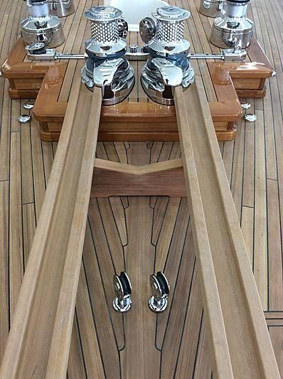 a wooden table with a glass top aboard VAGRANT Yacht for Sale