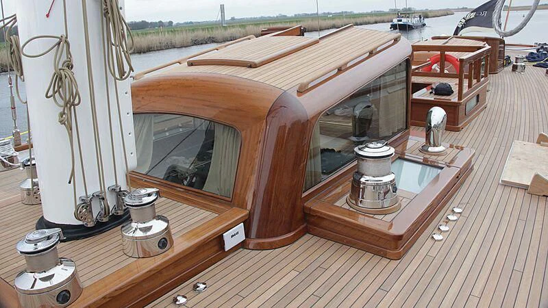 a wooden boat on display aboard VAGRANT Yacht for Sale