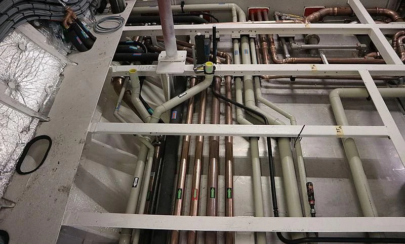a metal railing with pipes aboard VAGRANT Yacht for Sale