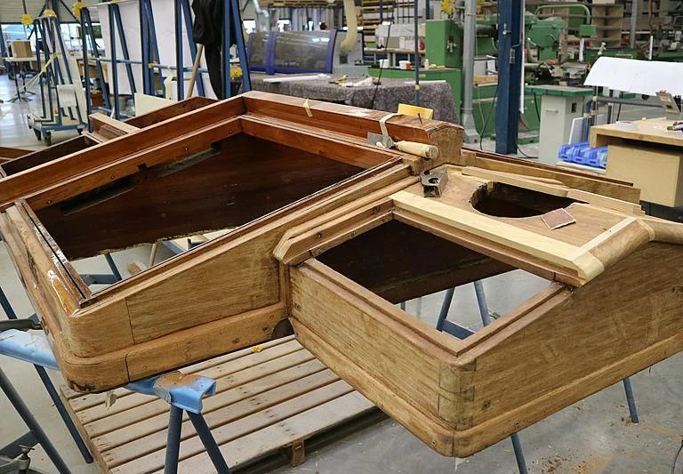 a wooden table with a metal frame aboard VAGRANT Yacht for Sale