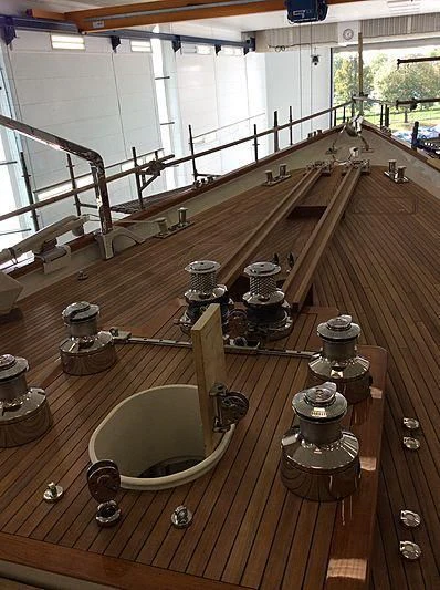 a large room with a set of bells and a railing aboard VAGRANT Yacht for Sale