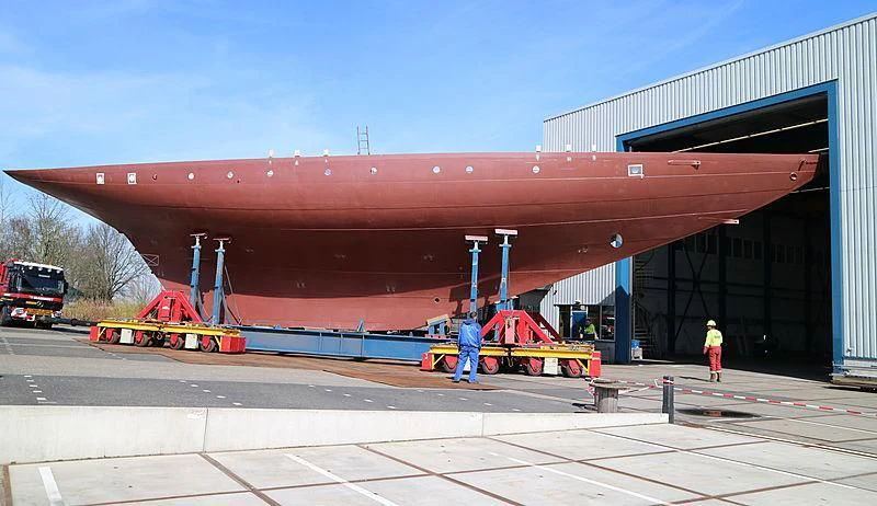 a large red container ship aboard VAGRANT Yacht for Sale