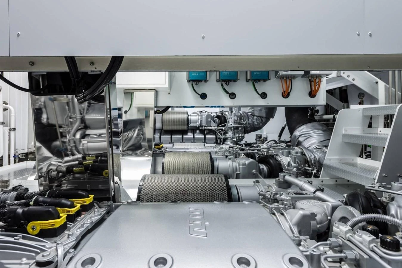 a car with a large engine aboard TOUCH ME Yacht for Sale