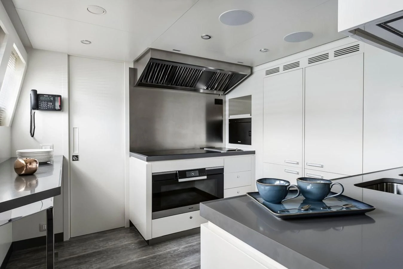 a kitchen with a stove and a microwave aboard TOUCH ME Yacht for Sale