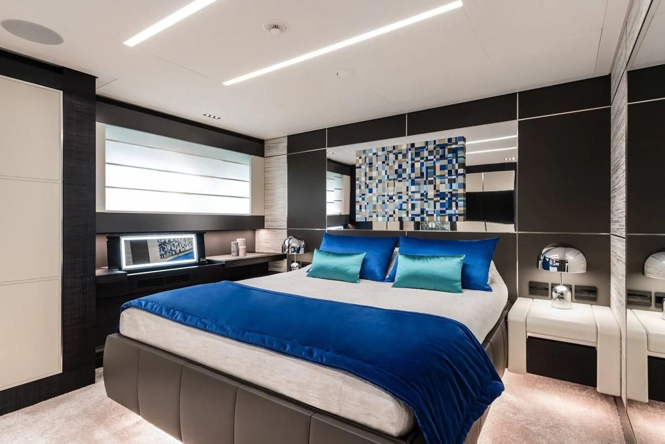 a bedroom with a bed and a tv aboard TOUCH ME Yacht for Sale