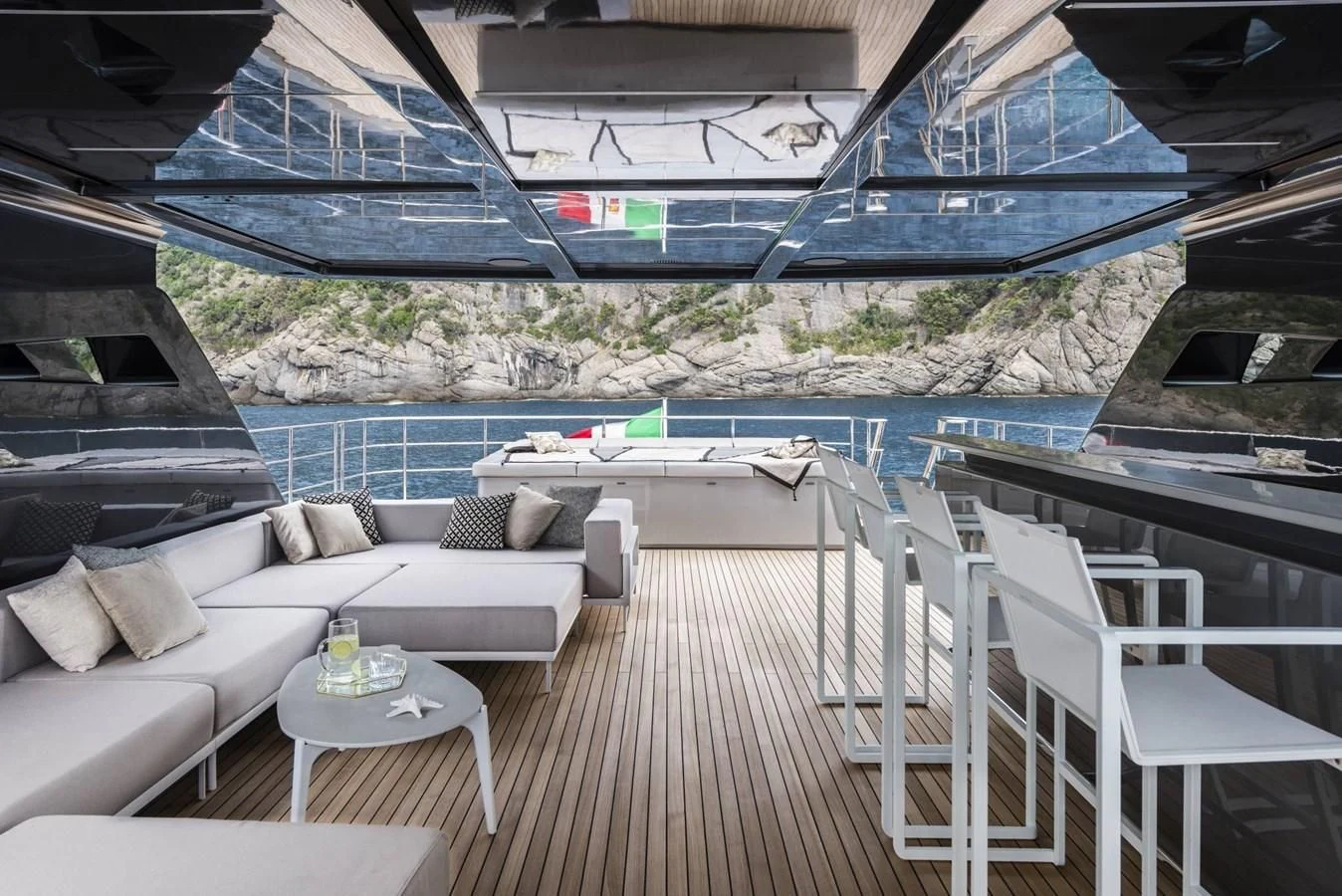 a deck with a pool and a couch aboard TOUCH ME Yacht for Sale