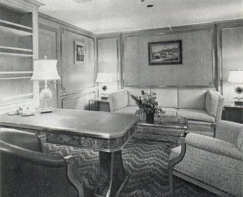 a living room with a large table and chairs aboard AL RIYADH Yacht for Sale