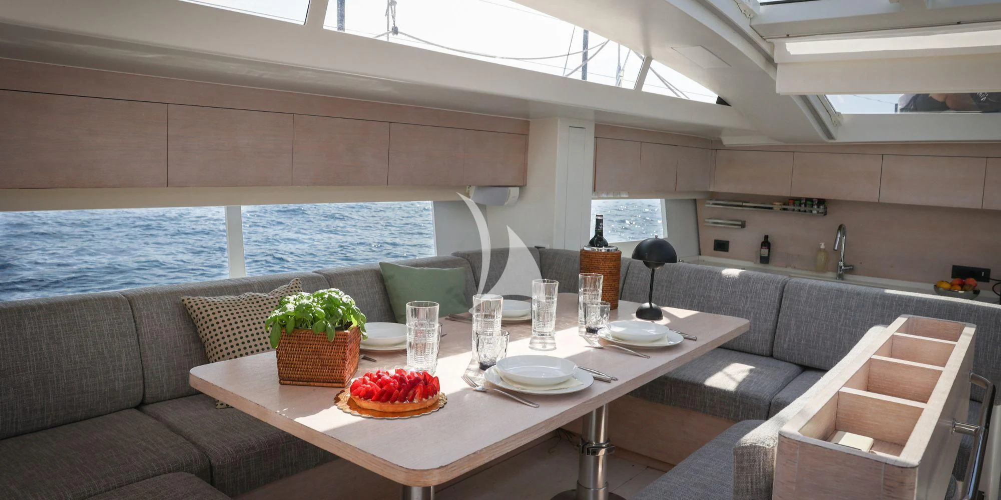 a room with a table and couches aboard LUCE GUIDA Yacht for Sale