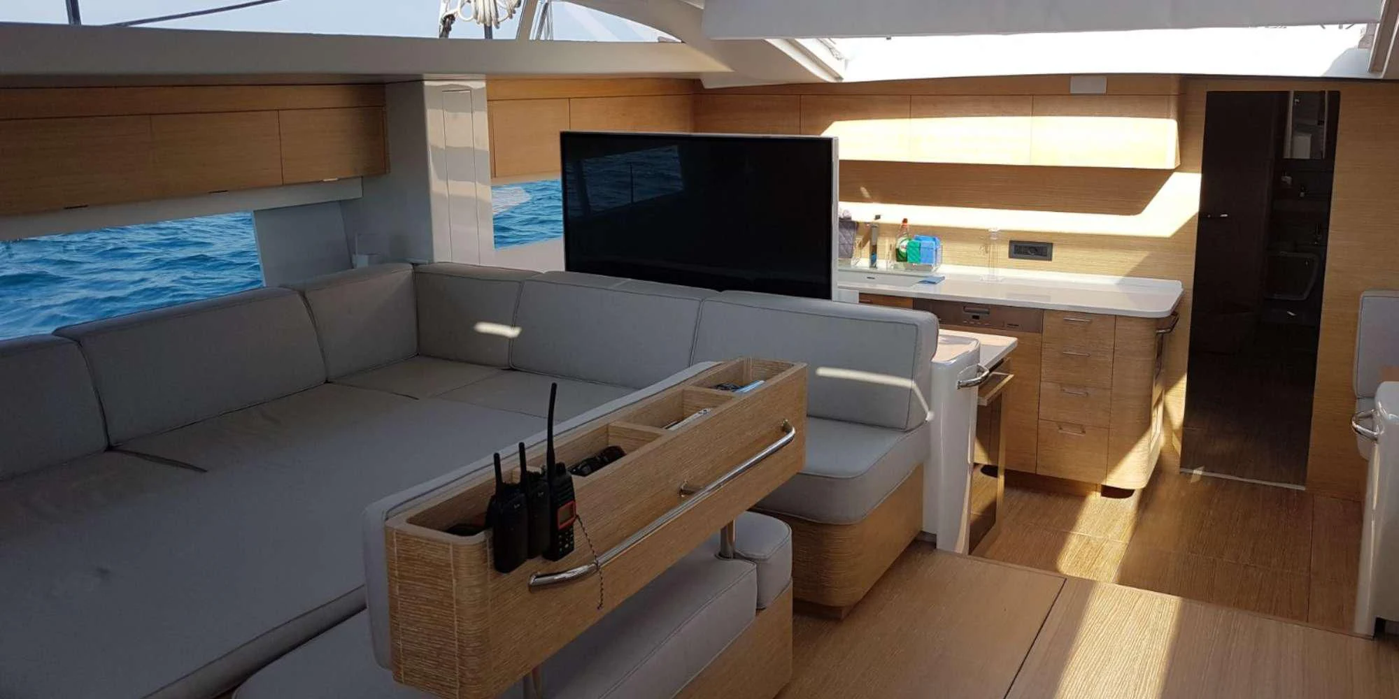 a room with a couch and a tv aboard LUCE GUIDA Yacht for Sale