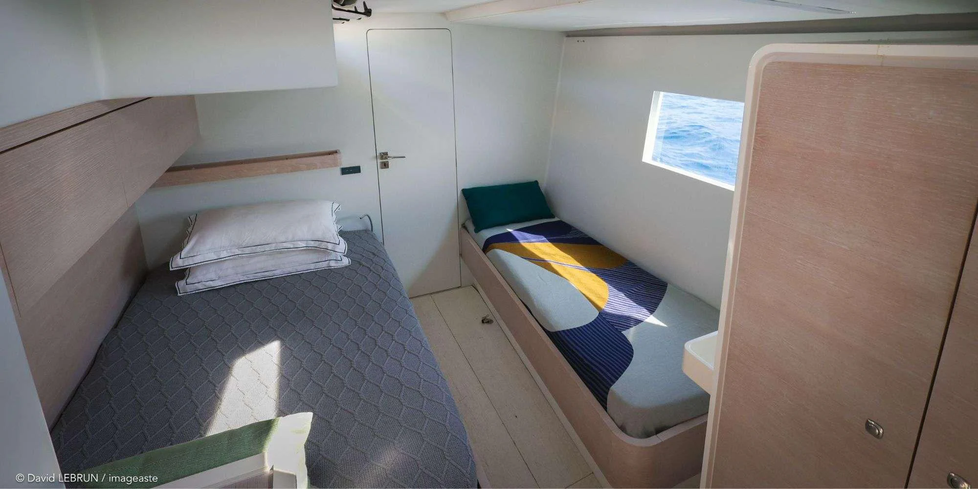 a small room with a bed and a closet aboard LUCE GUIDA Yacht for Sale
