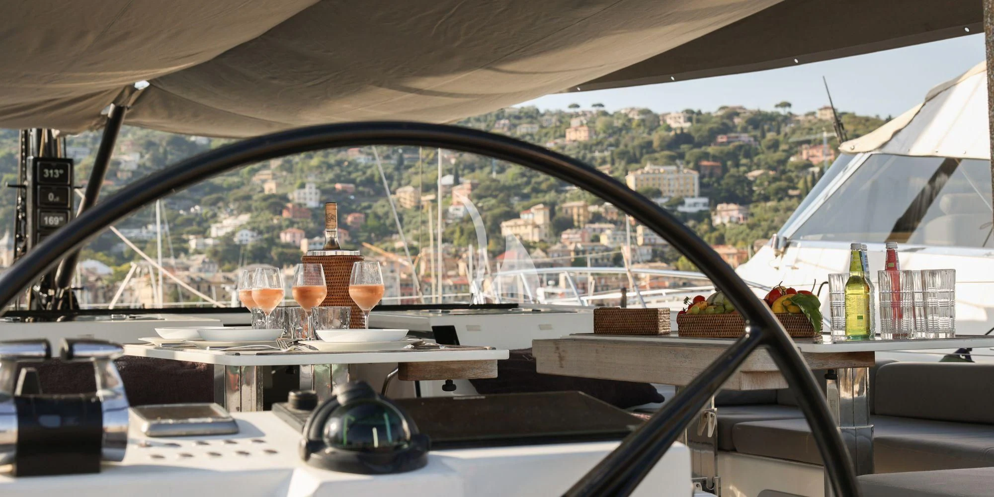 a table with glasses on it aboard LUCE GUIDA Yacht for Sale