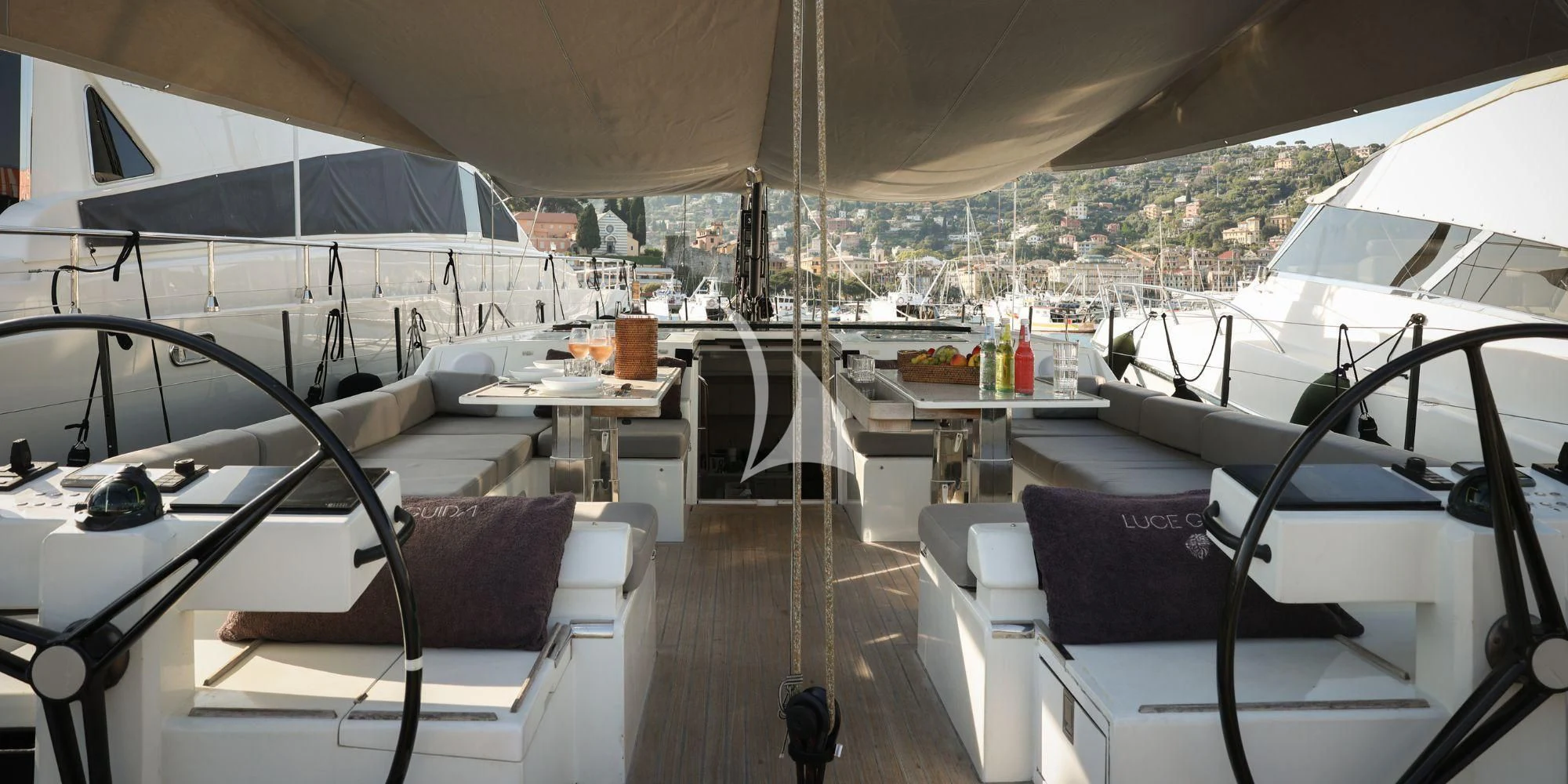 a boat with a table and chairs aboard LUCE GUIDA Yacht for Sale