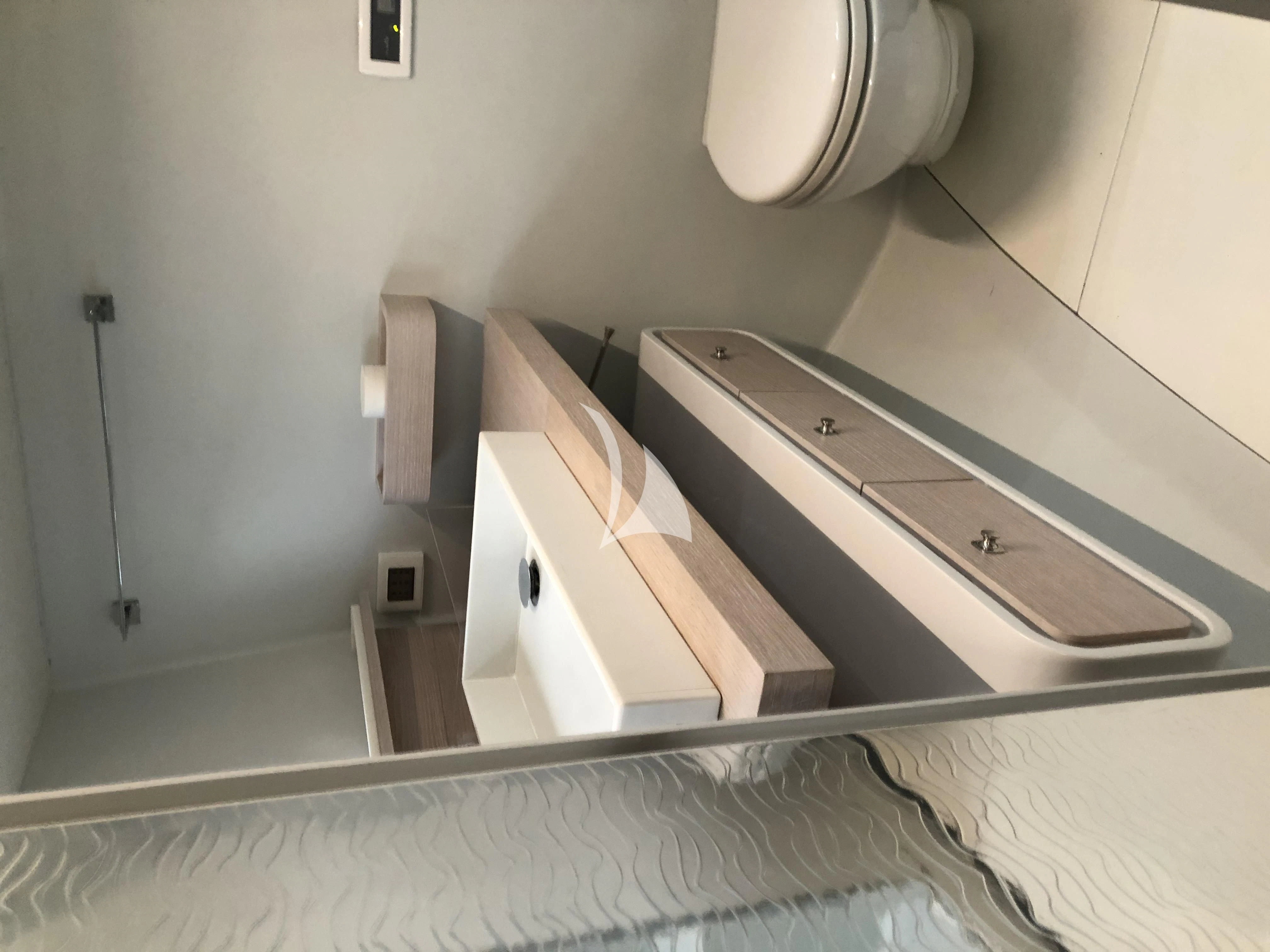 a bathroom with a sink and a toilet aboard LUCE GUIDA Yacht for Sale