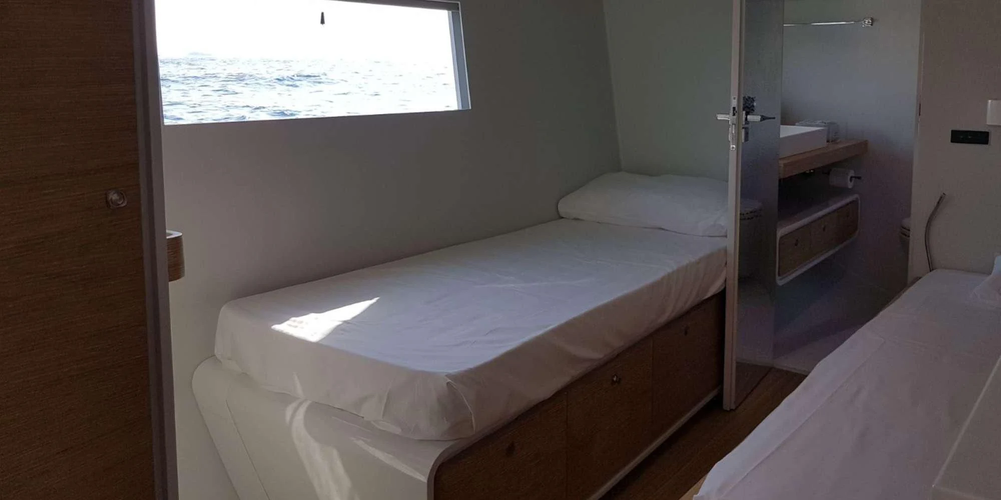 a room with two beds aboard LUCE GUIDA Yacht for Sale