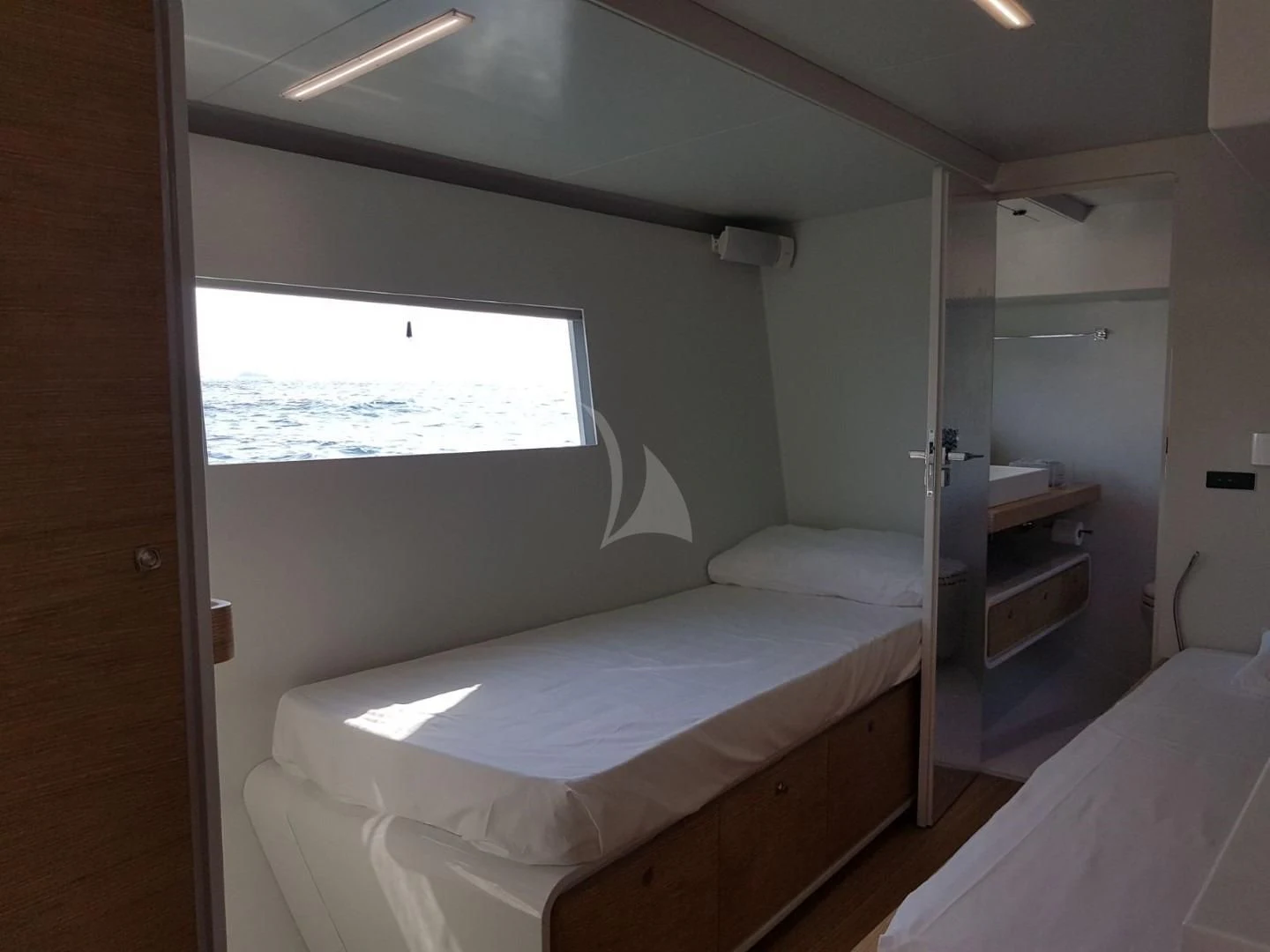 a room with two beds aboard LUCE GUIDA Yacht for Sale