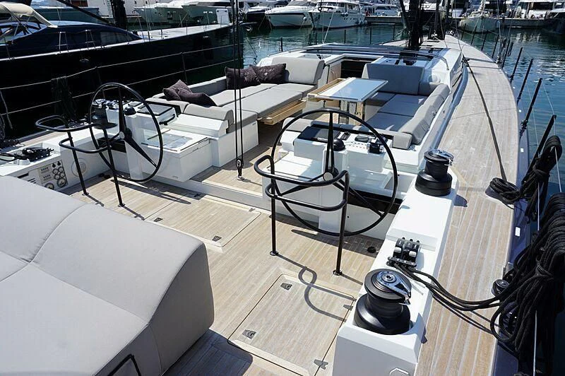 a large white boat with a black frame and a white table on it aboard LUCE GUIDA Yacht for Sale