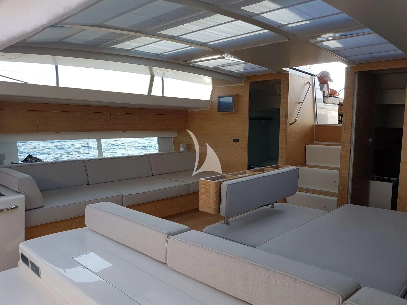 a room with a couch and a window aboard LUCE GUIDA Yacht for Sale