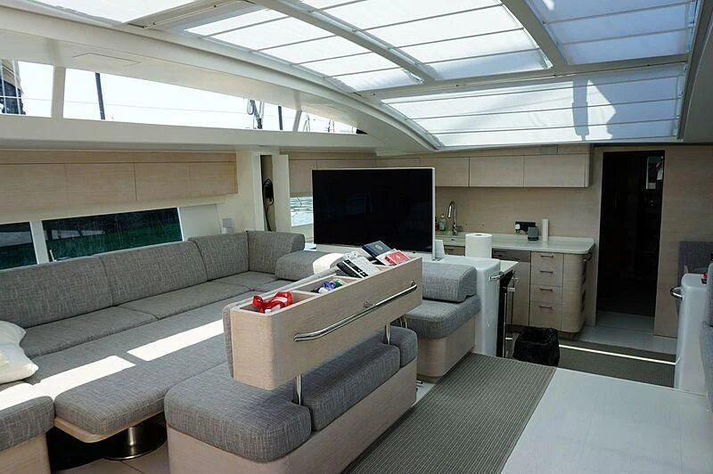 a room with a couch and a tv aboard LUCE GUIDA Yacht for Sale