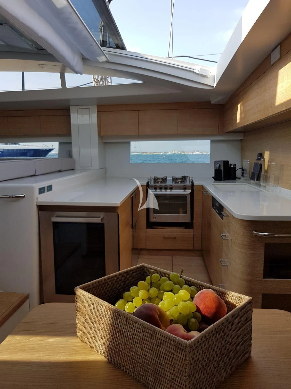 a basket of fruits on a counter aboard LUCE GUIDA Yacht for Sale