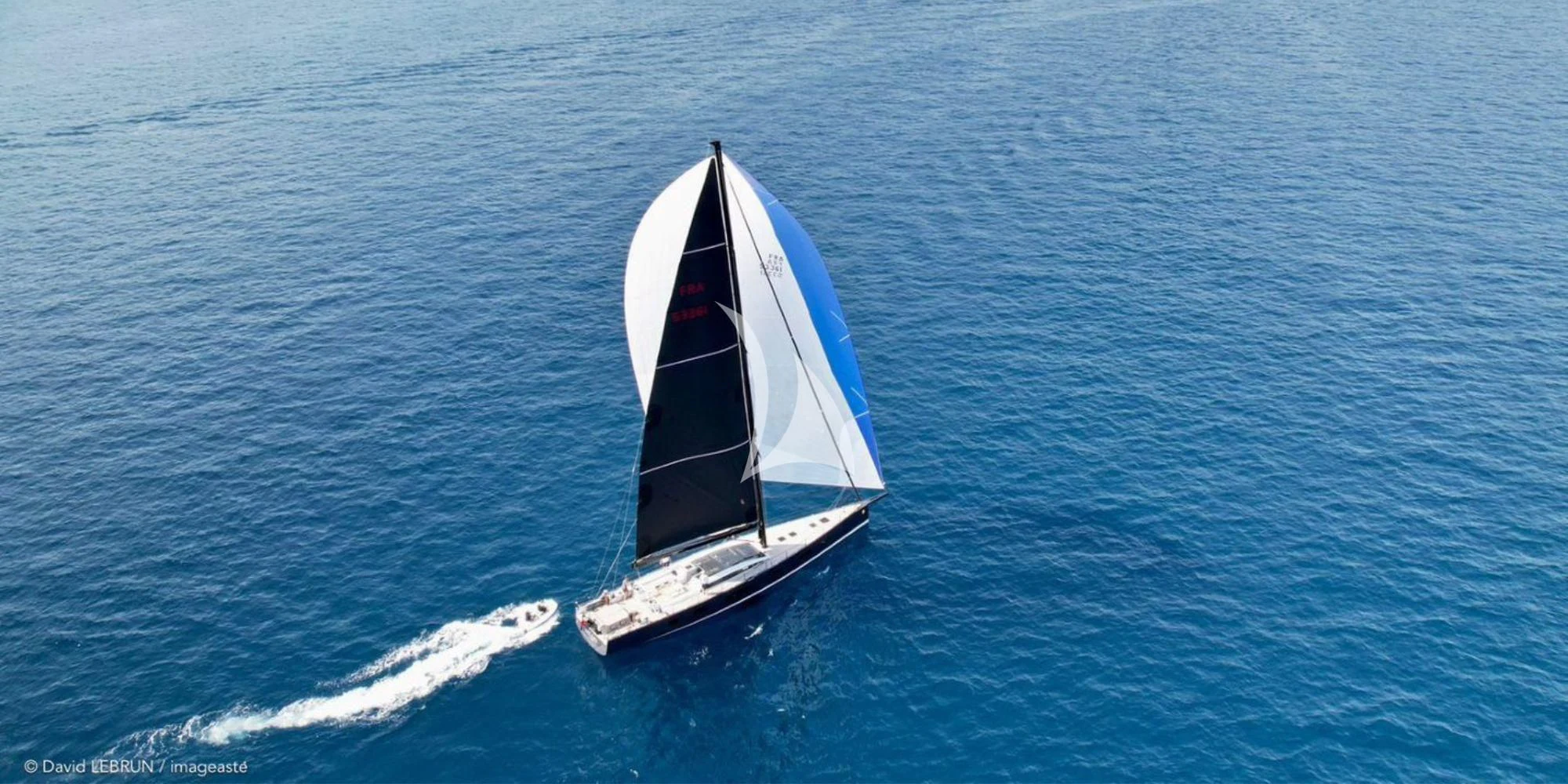 a black and white boat on water aboard LUCE GUIDA Yacht for Sale