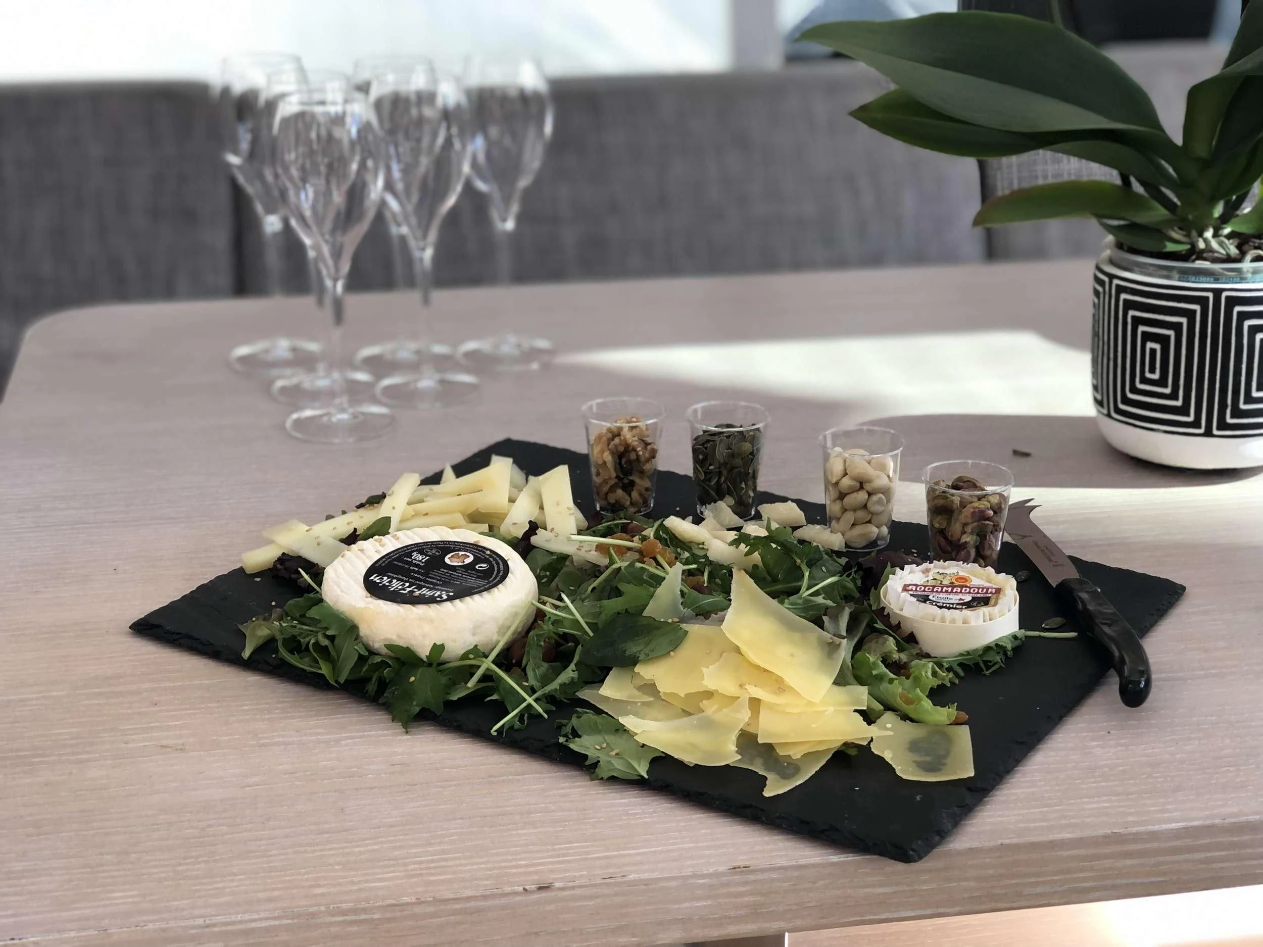 a plate of sushi and glasses aboard LUCE GUIDA Yacht for Sale