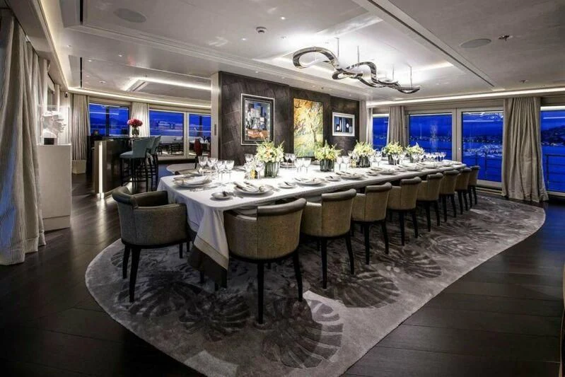 a large dining room table aboard M'BRACE Yacht for Sale