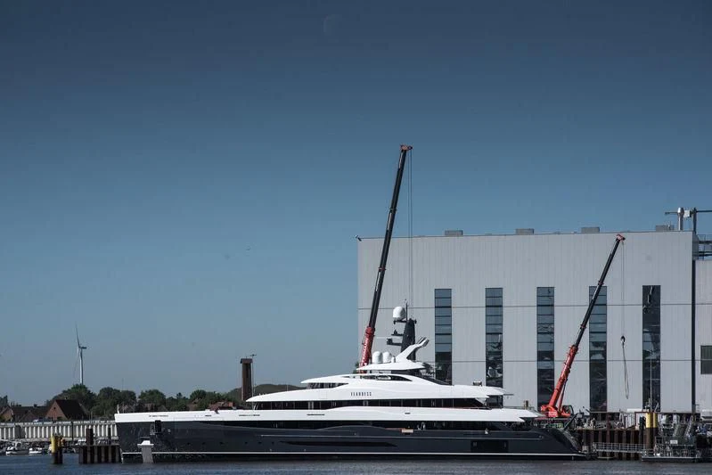 a large white boat in a dock aboard M'BRACE Yacht for Sale