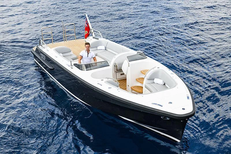 a person in a white boat aboard M'BRACE Yacht for Sale