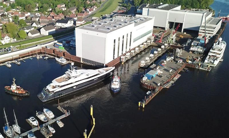 a large ship docked at a dock aboard M'BRACE Yacht for Sale