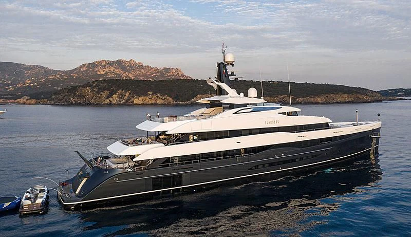 a large ship in the water aboard M'BRACE Yacht for Sale