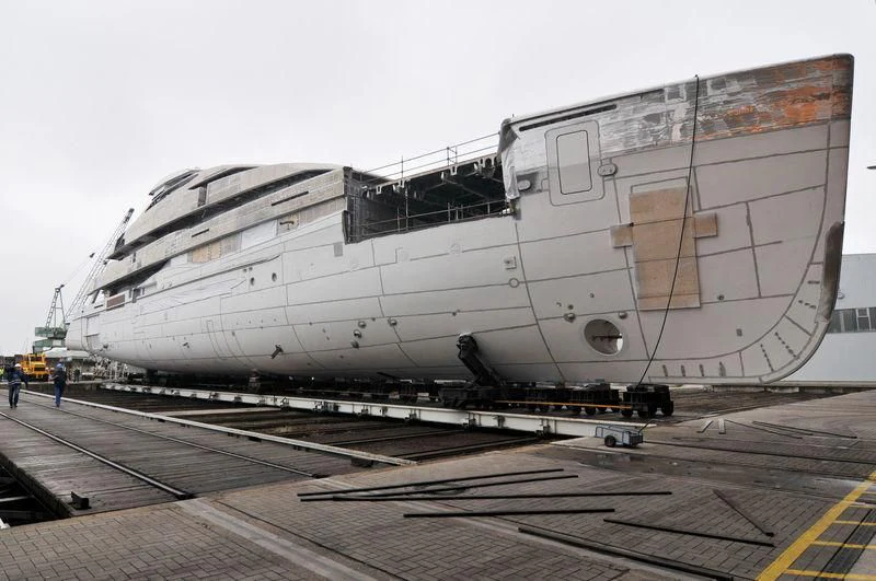 a large ship on a dock aboard M'BRACE Yacht for Sale
