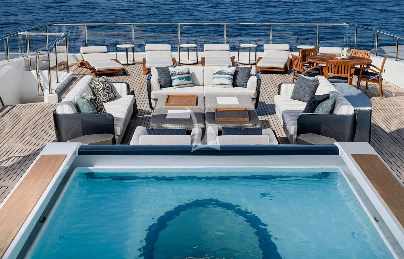 a pool with a couch and chairs aboard M'BRACE Yacht for Sale