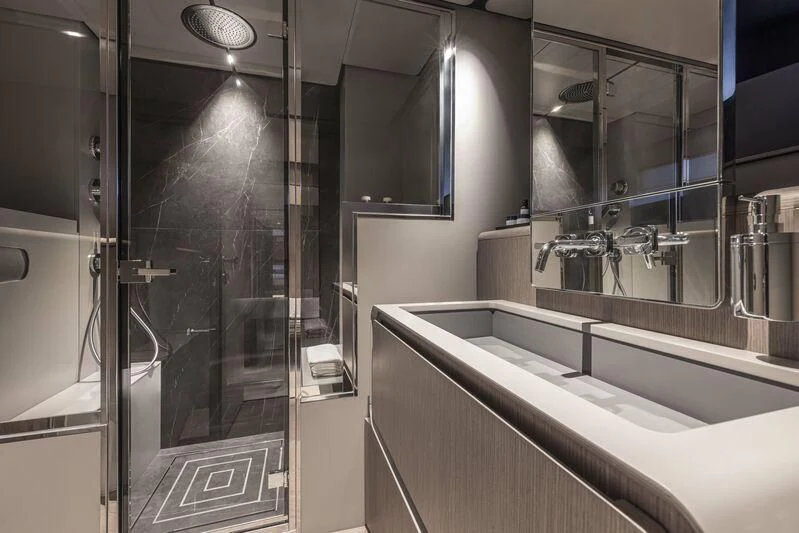 a bathroom with a glass shower aboard INFYNITO 90/01 Yacht for Sale