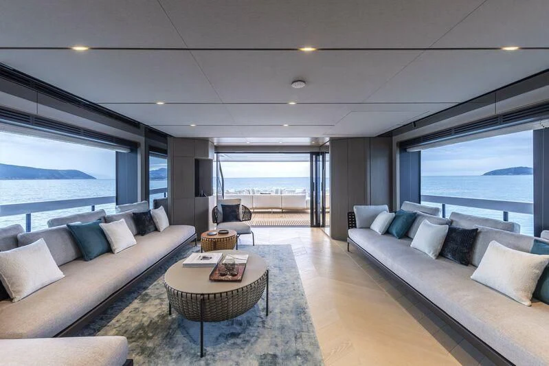 a living room with a large window aboard INFYNITO 90/01 Yacht for Sale