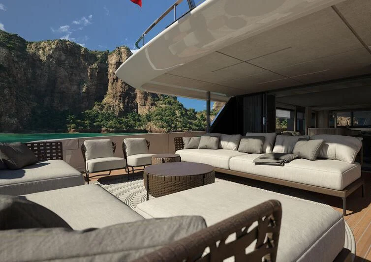 a living room with a large white couch and a large window aboard INFYNITO 90/01 Yacht for Sale