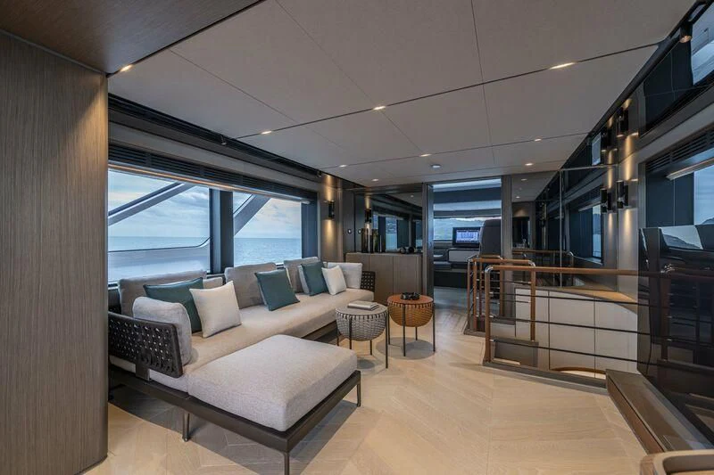 a living room with a large window aboard INFYNITO 90/01 Yacht for Sale