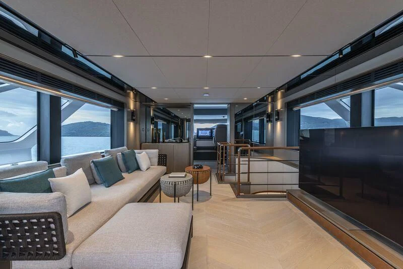 a living room with a large window aboard INFYNITO 90/01 Yacht for Sale